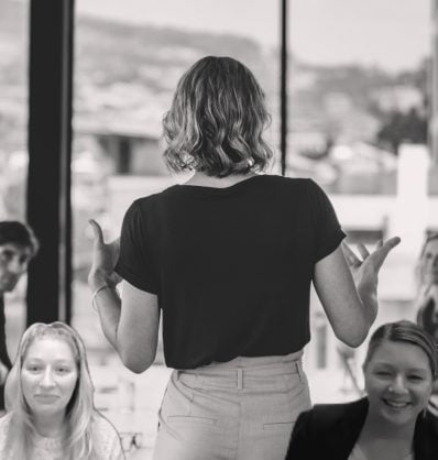 AcctTwo HR manager and Senior HR manager superimposed on board room with professional woman presenting