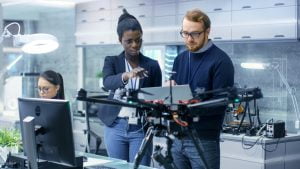 Diverse startup team working on drone, representing the Industrial Drone startup case study that uses Employee Cycle's diversity dashboard