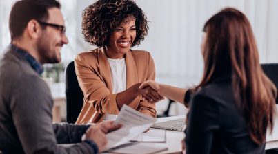 Four things to change for better recruitment - women shaking hands in job interview