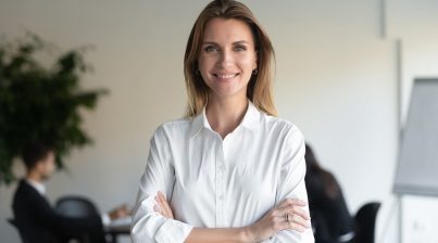 HR manager female professional manager standing arms crossed looking at camera