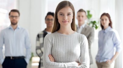 HR recruiter businesswoman with professional candidates behind her