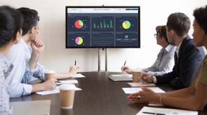 TV Dashboard Employee Cycle Diversity Dashboard with Board Members Observing in a Conference Room