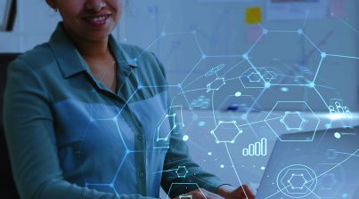 Young business woman in shirt working using laptop while analyzing HR metrics and analytics