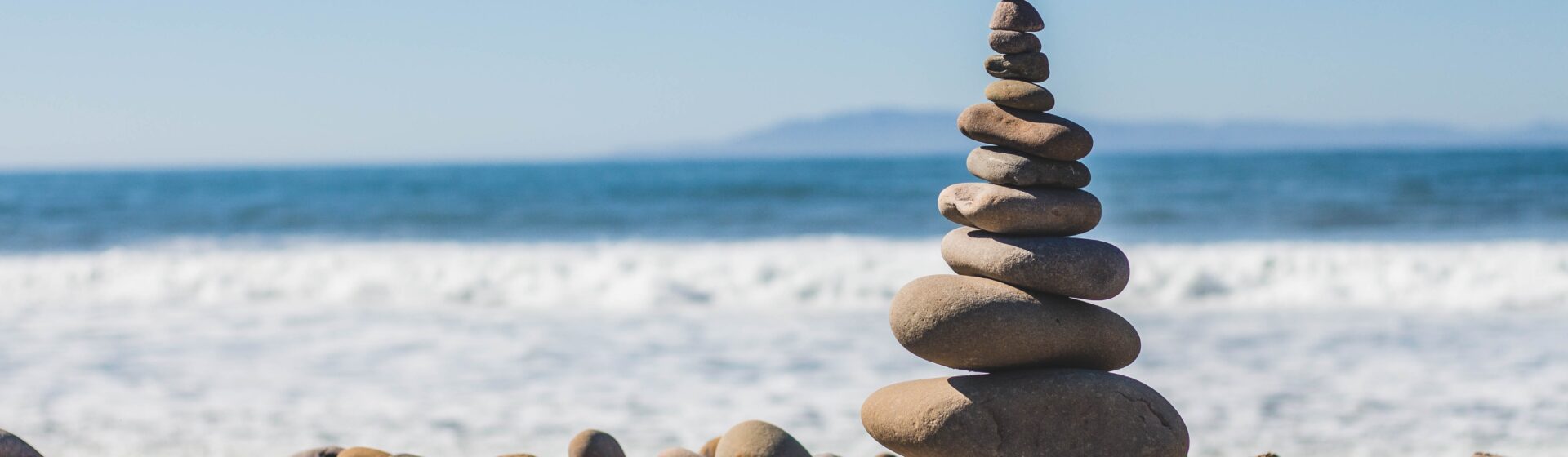 Stacked rocks on seashore