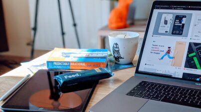 Desk with notes, laptop, and snacks