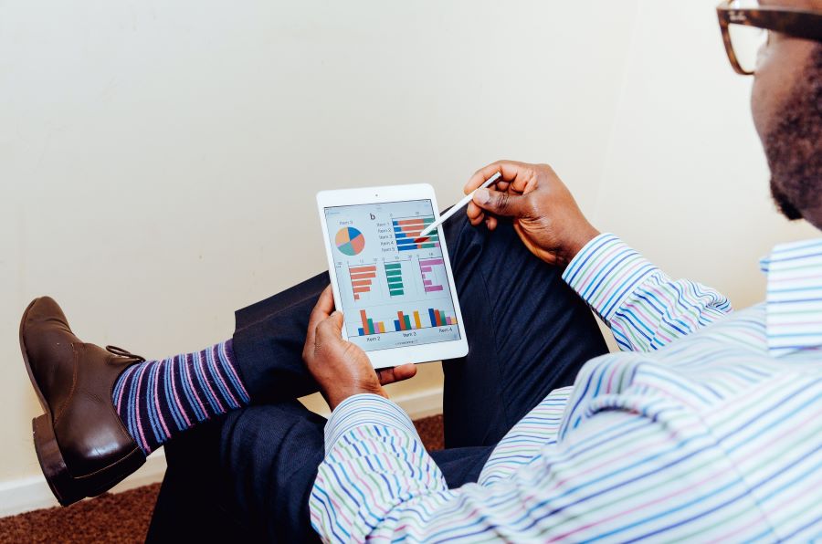 Man looking at people analytics on a tablet